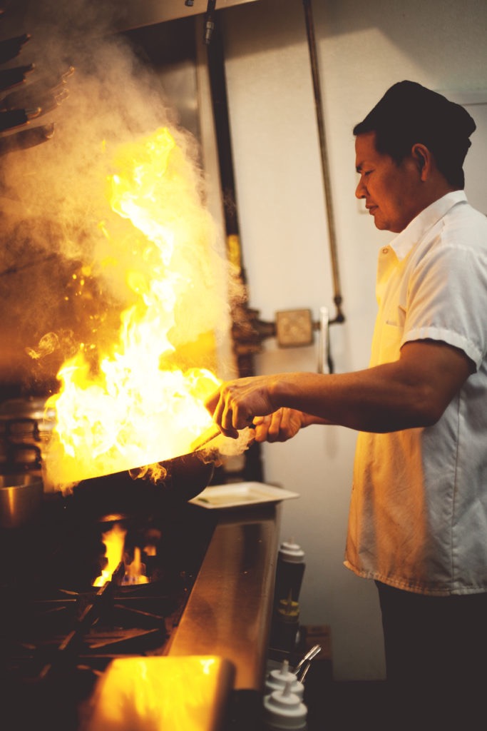 Sayan, head cheif and co-owner, manages flaming dish